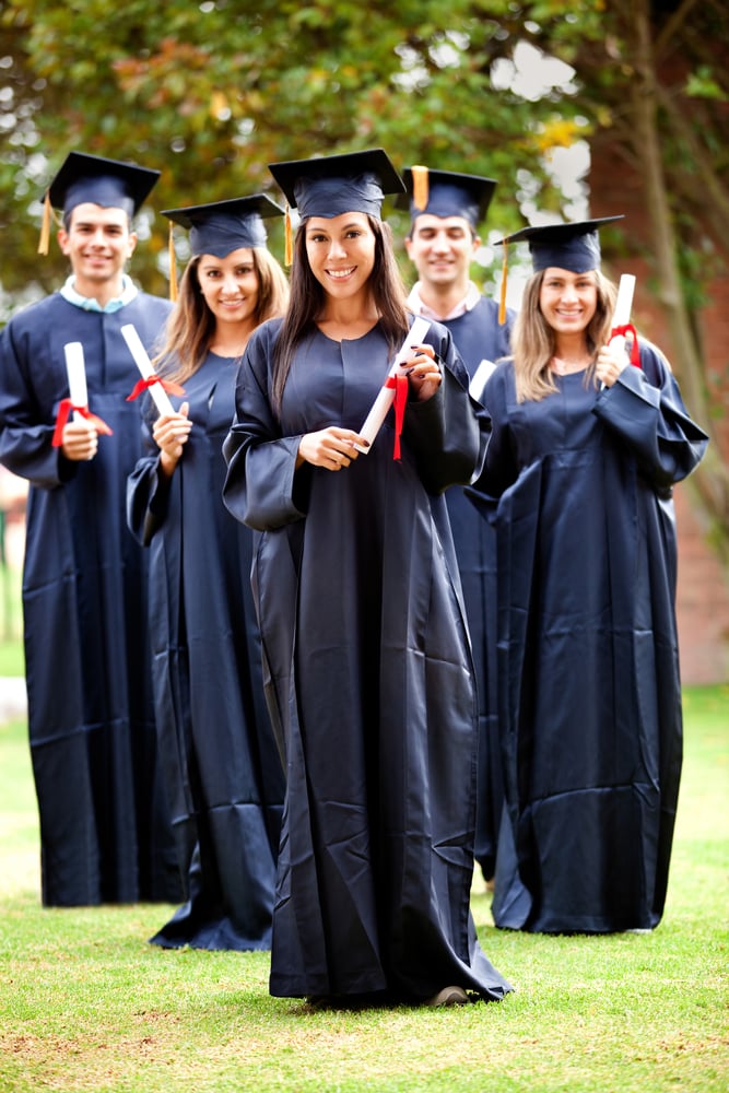 Happy group of students in their graduation smiling